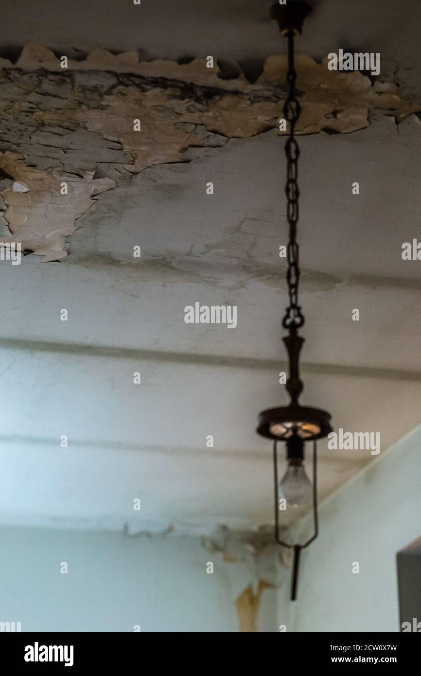 damp spots in the ceiling caused by water infiltration Stock Photo