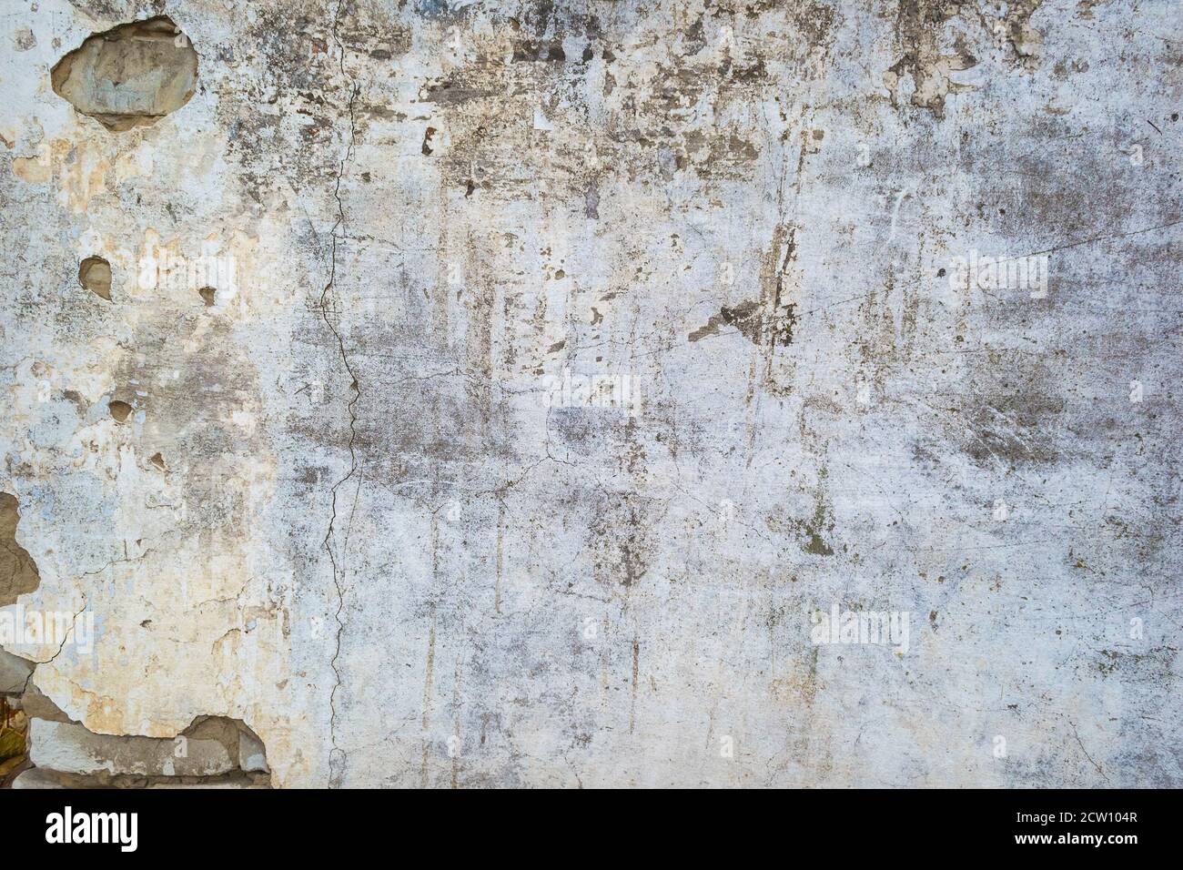 Cracked concrete wall texture or background. Closeup Stock Photo