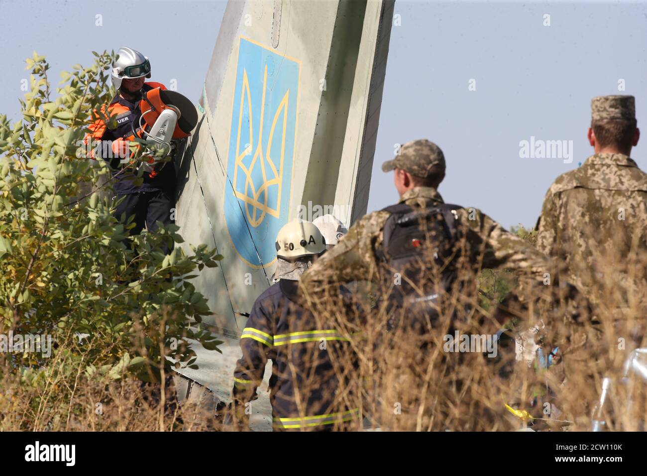 (200926) -- KHARKIV, Sept. 26, 2020 (Xinhua) -- Rescuers cut the wreckage of the crashed An-26 military aircraft in Chuguev, Kharkiv region, Ukraine, Sept. 26, 2020. The death toll from the Ukrainian military plane crash rose to 26, after one of the two people with serious condition died in hospital, the State Emergency Service of Ukraine said on Saturday. The An-26 military aircraft with 27 people on board crashed on Friday. The plane was performing a training flight and was landing at the airfield of a military base near the city of Chuguev, Kharkiv region. (Photo by Sergey Starostenko/Xi Stock Photo
