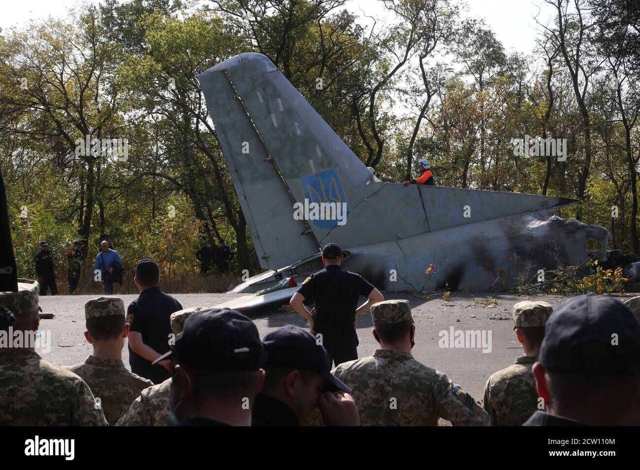 (200926) -- KHARKIV, Sept. 26, 2020 (Xinhua) -- Rescuers cut the wreckage of the crashed An-26 military aircraft into parts in Chuguev, Kharkiv region, Ukraine, Sept. 26, 2020. The death toll from the Ukrainian military plane crash rose to 26, after one of the two people with serious condition died in hospital, the State Emergency Service of Ukraine said on Saturday. The An-26 military aircraft with 27 people on board crashed on Friday. The plane was performing a training flight and was landing at the airfield of a military base near the city of Chuguev, Kharkiv region. (Photo by Sergey Sta Stock Photo