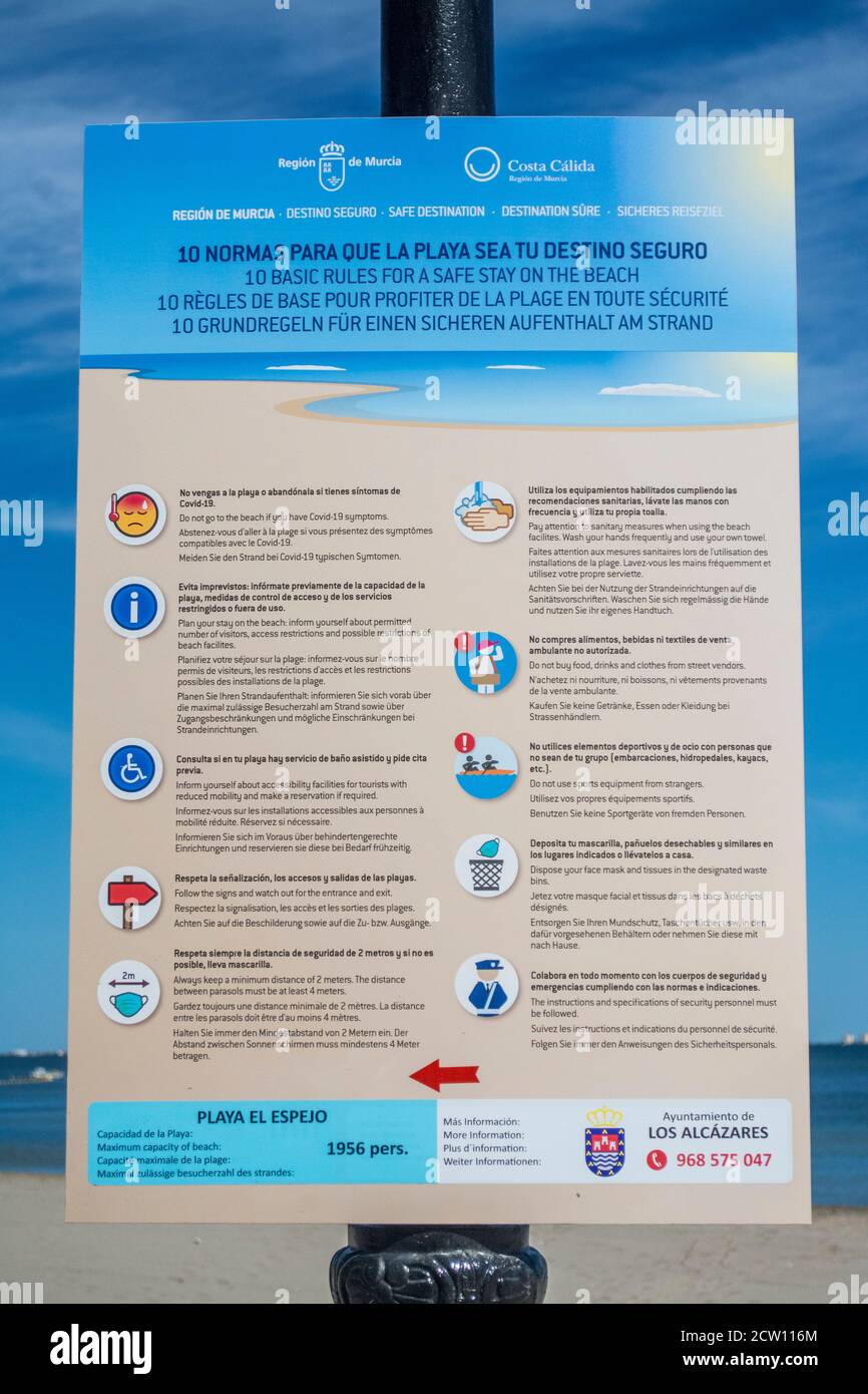 Sign to detail the 10 basic rules to stay safe on the beach during COVID 19 at Los Alcazares in Murcia Spain Stock Photo