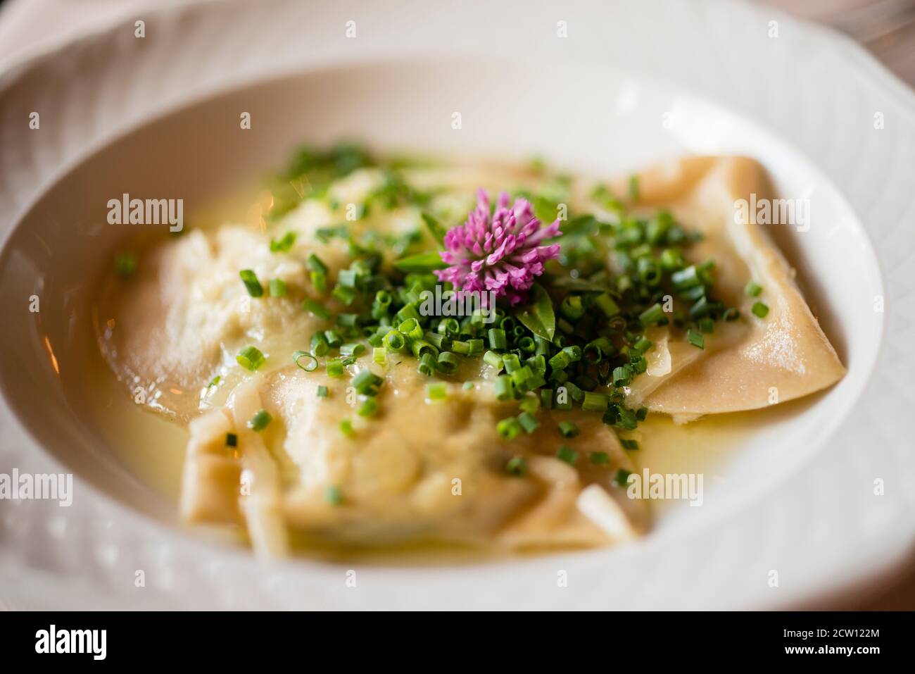 Bowl of traditional Italian Tortelli pasta stuffed with vegetables. Stock Photo