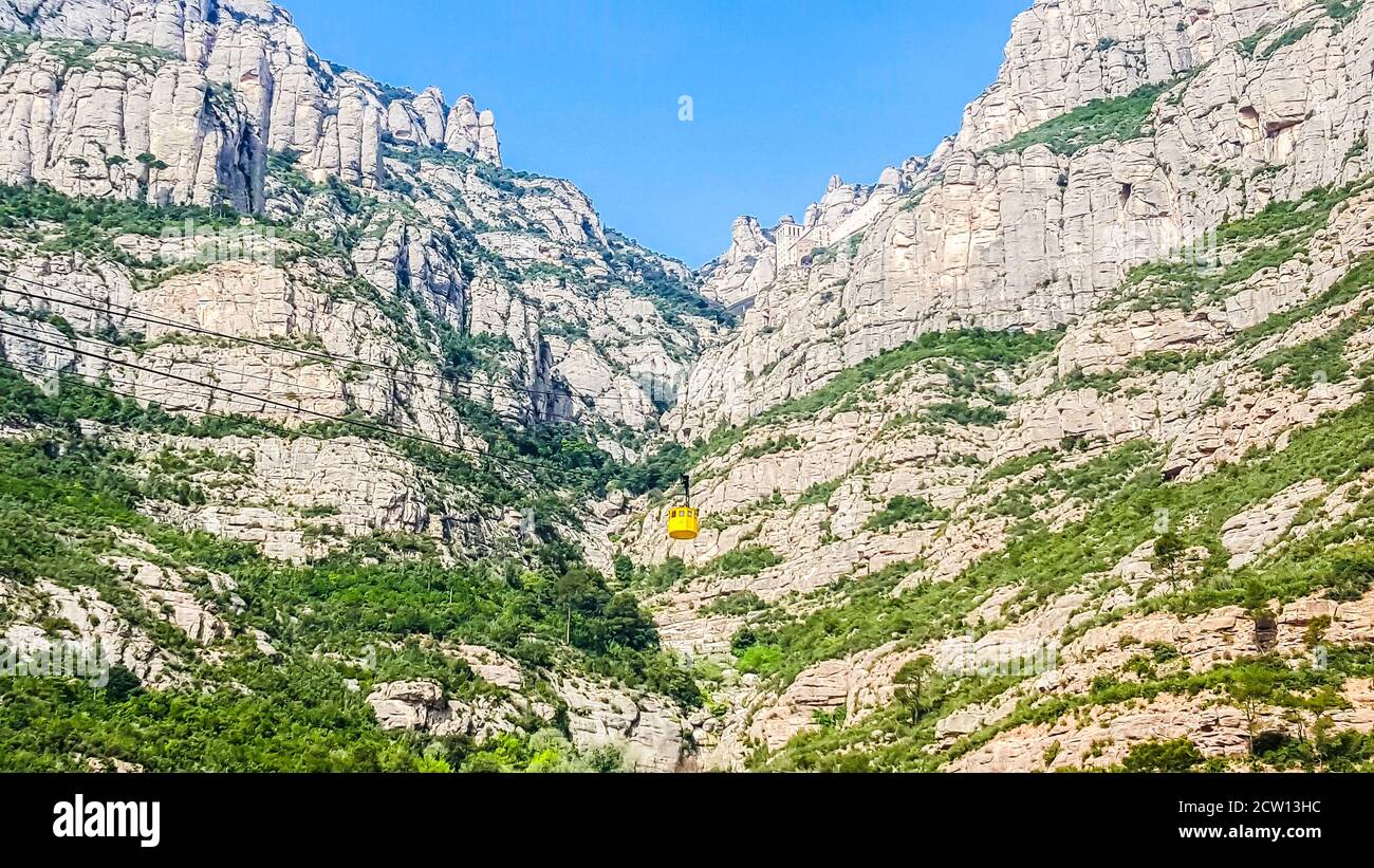 Yellow cabin cable car to Montserrat Monastery, Barcelona, Spain Stock Photo