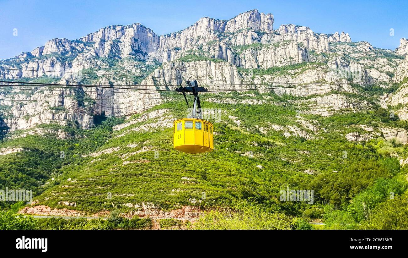 Yellow cabin cable car to Montserrat Monastery, Barcelona, Spain Stock Photo