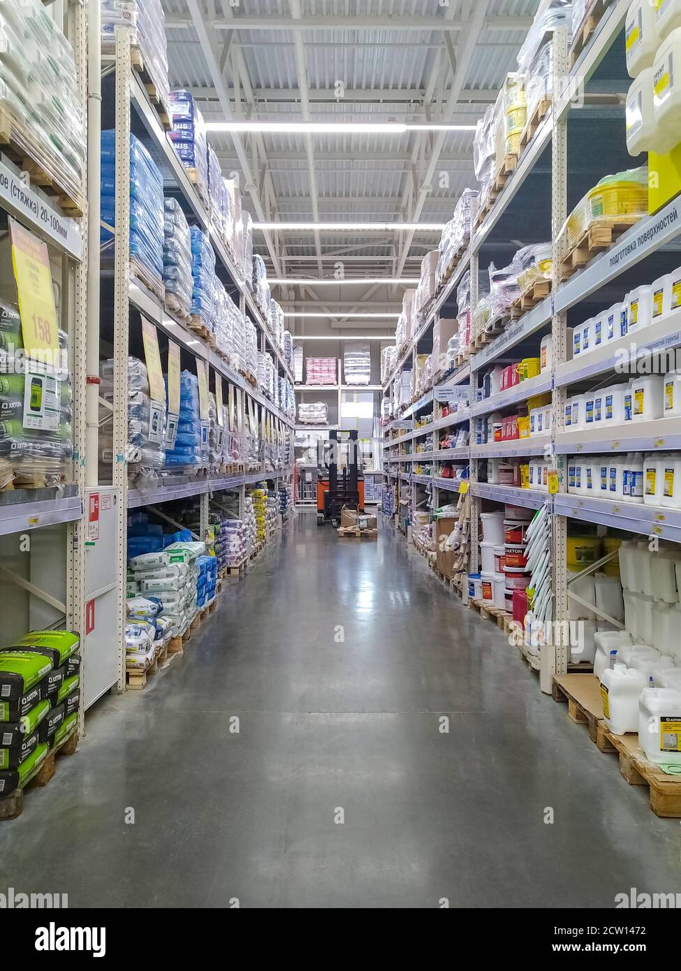 Row of shelves with construction goods in a warehouse store Stock Photo