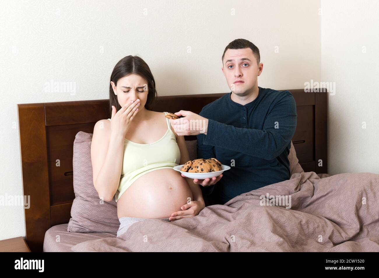 Husband offers cookies to his pregnant wife but she refuses and makes
