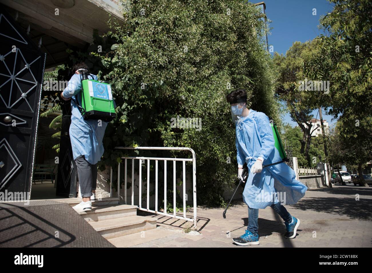 Group of Volunteers in Damascus conducting regularly sterilization session to support government during Covid -19 in Syria Damascus Stock Photo