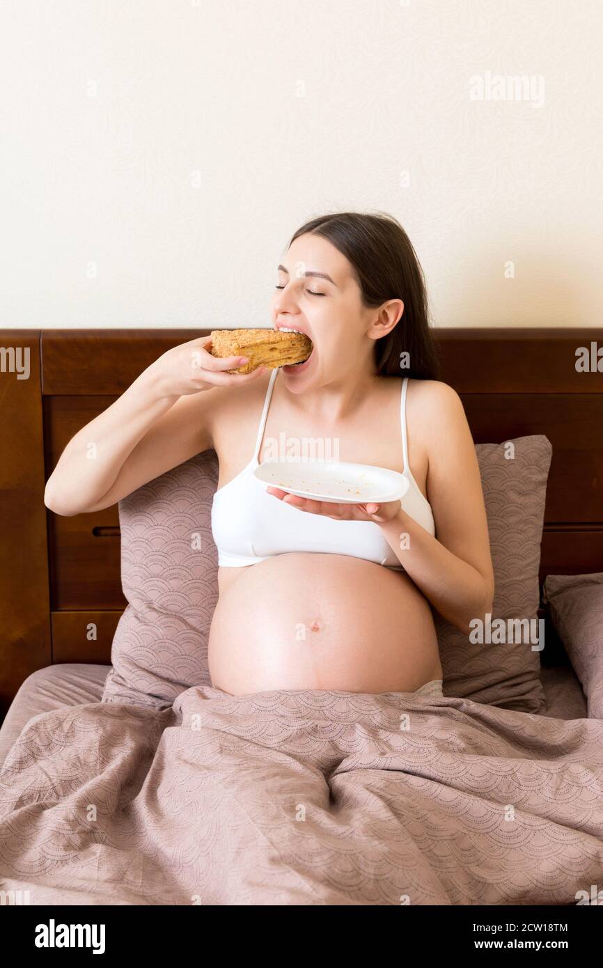 Sweets during Pregnancy. Young Black Man Giving Yummy Cake To His Happy  Expectant Girlfriend in Kitchen Stock Photo - Image of expecting,  boyfriend: 203523652