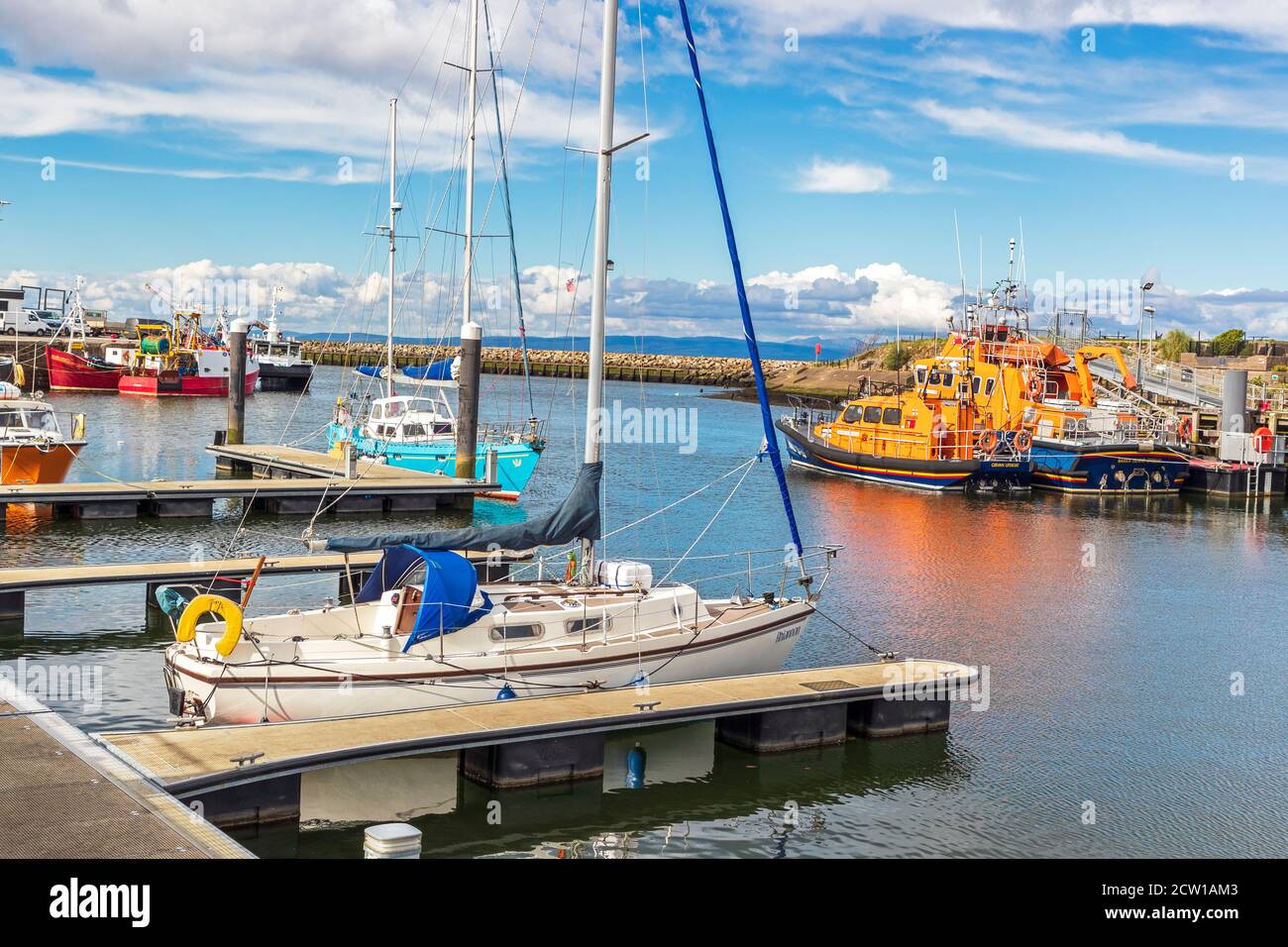 General view of Girvan harbour, Ayrshire Scotland showing small fishing boats and private boats and lifeboats, UK on the Firth of Clyde Stock Photo