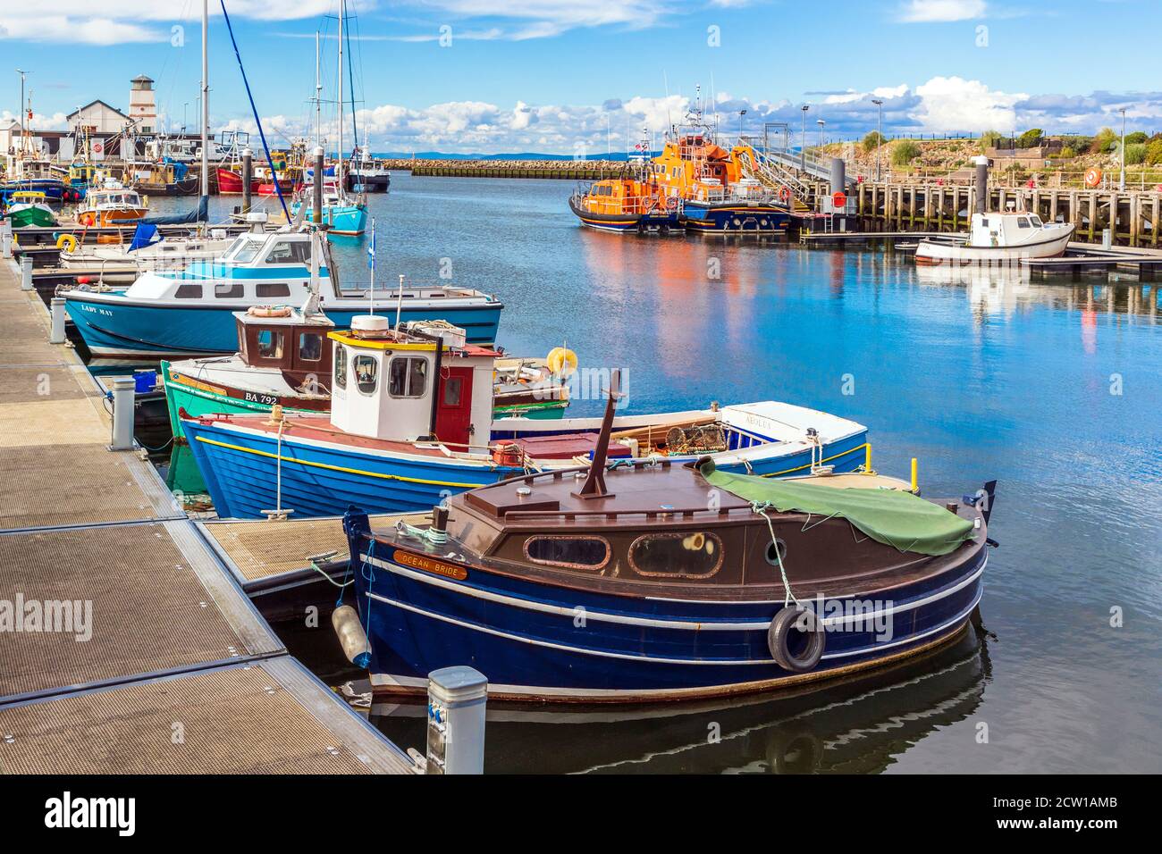 General view of Girvan harbour, Ayrshire Scotland showing small fishing boats and private boats and lifeboats, UK on the Firth of Clyde Stock Photo