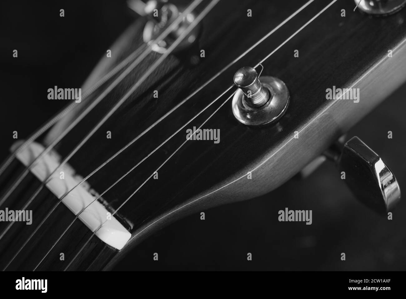 Tuning mechanics of a guitar in detail, detailed photo of tuning screws of  a guitar, guitar strings, guitar neck, guitar head in detail Stock Photo -  Alamy
