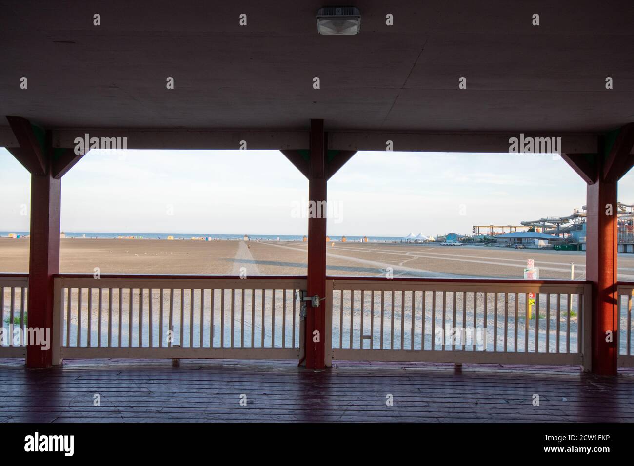 Standing Under a Pavillion on the Wildwood Boardwalk Looking Out at the Beach Stock Photo