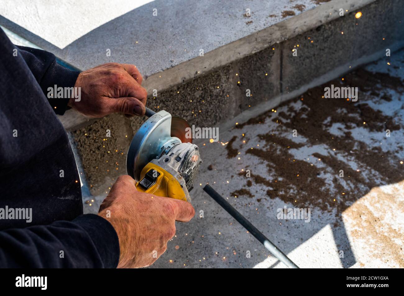 Metal industry worker grinding steel bar Stock Photo Alamy