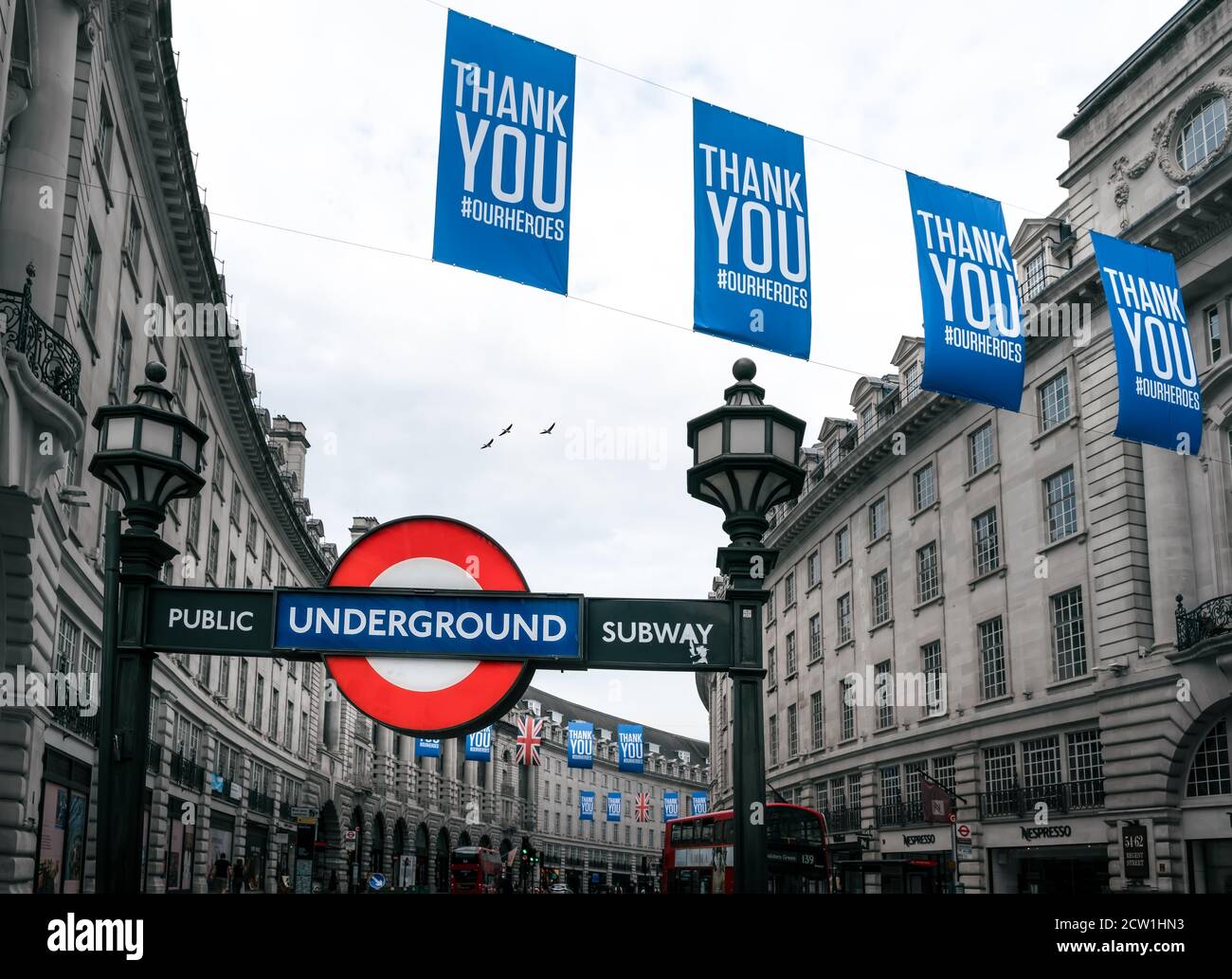 London - 08 August 2020 - Piccadilly Underground Tube Station Sign with NHS Thank You Banners Post Lockdown in London, UK Stock Photo