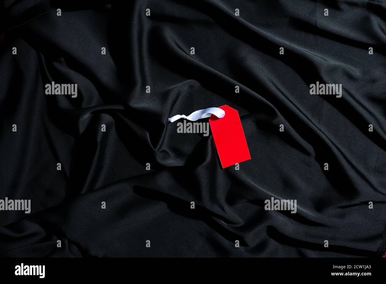 Download Mockup Red Paper Clothing Label With White Ribbon On A Black Silk Tissue Background Copy Space Top View Black Friday Sale Concept Stock Photo Alamy