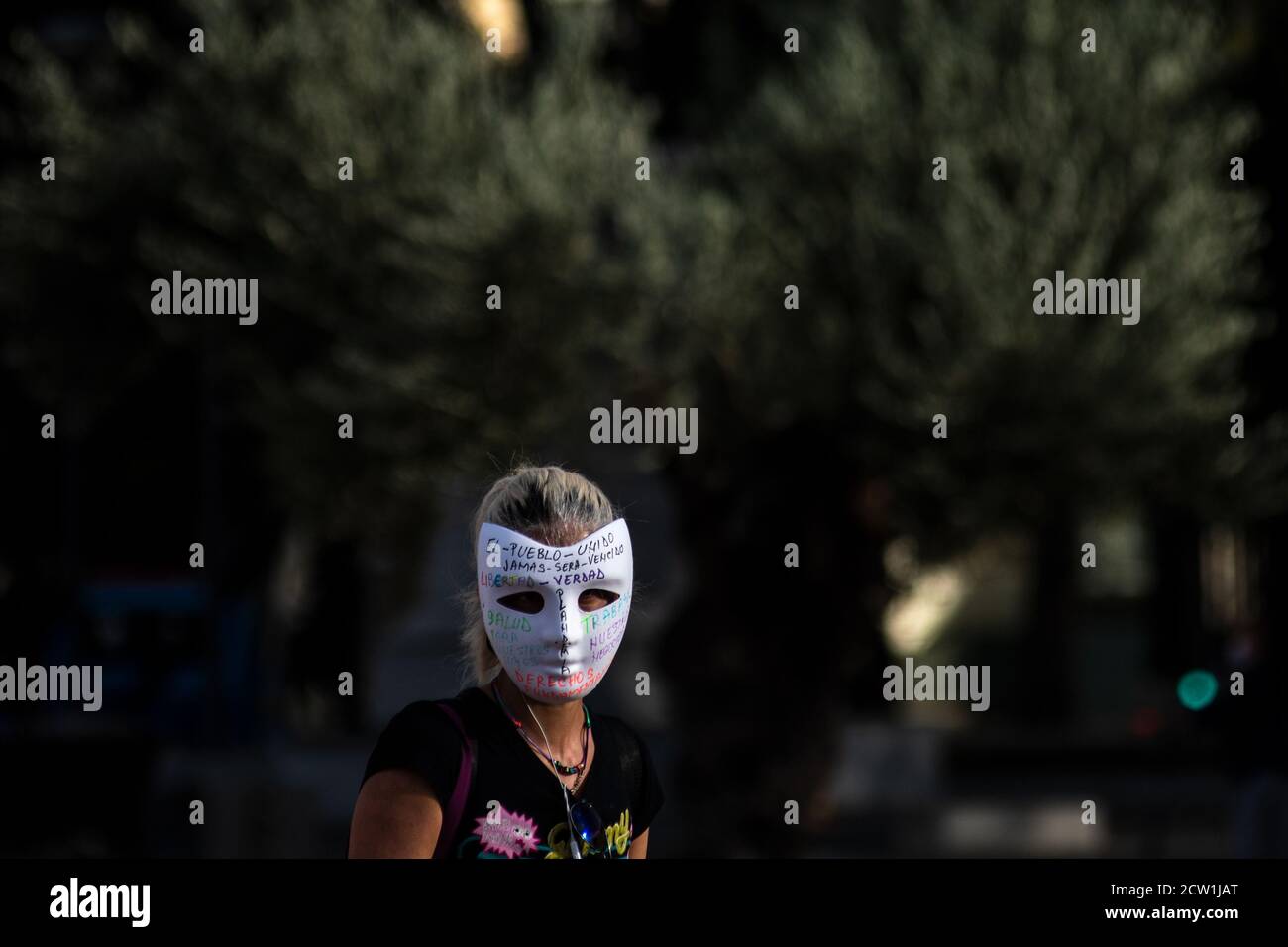 Madrid, Spain. 26th Sep, 2020. A woman wearing a mask during a protest of coronavirus sceptics protesting against the use of face masks, vaccines and 5G. Credit: Marcos del Mazo/Alamy Live News Stock Photo