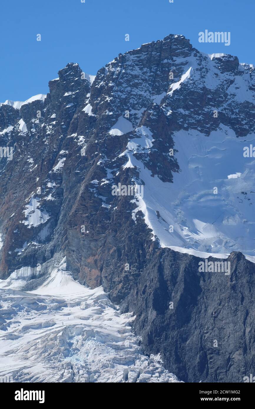 The beautiful line of the Young Ridge to the eastern summit of the Breithorn in the Swiss alps. Stock Photo