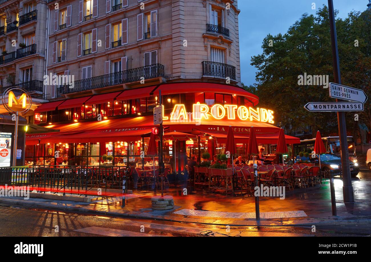 The famous cafe La Rotonde at rainy night , Paris, France Stock Photo ...