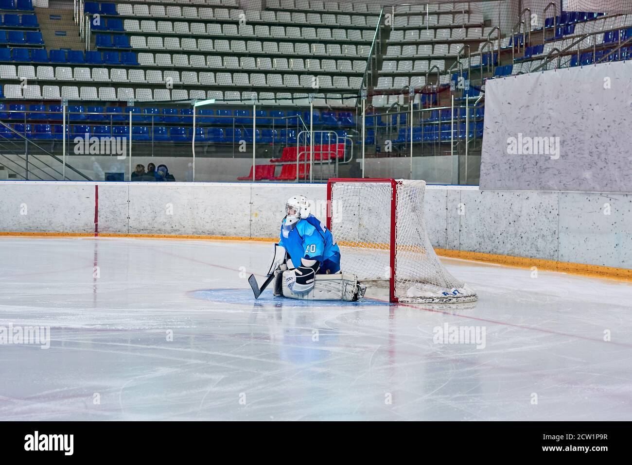 hockey goalie hits the puck Stock Photo