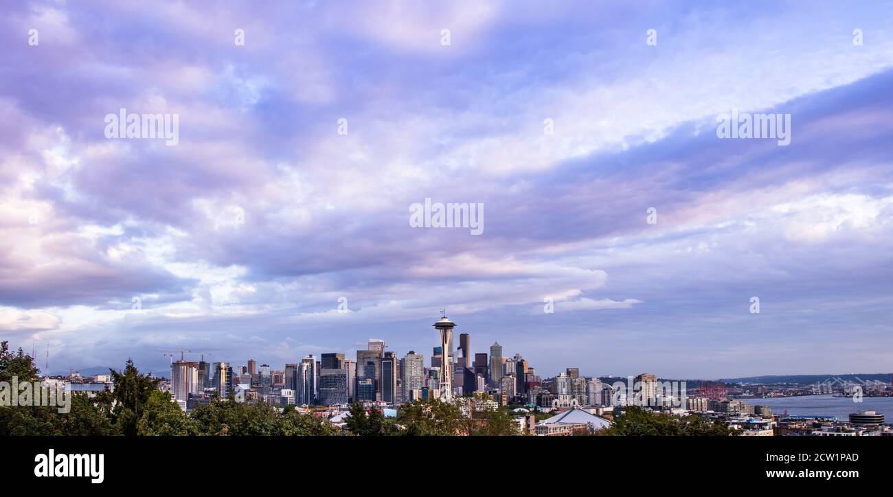 Cloudy Seattle skyline with the iconic Space Needle at dusk Stock Photo ...