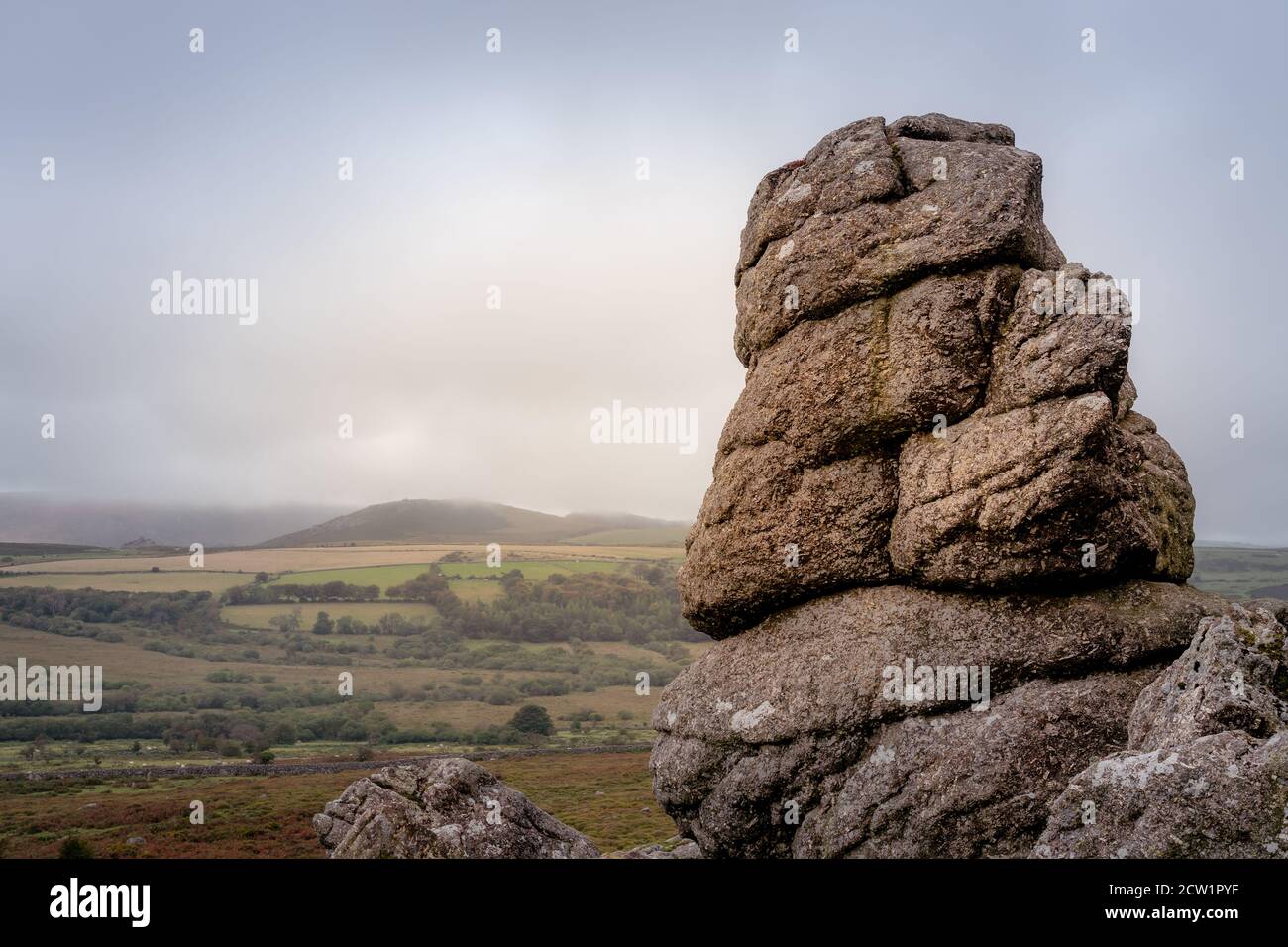 Weathered granite outcrop on moorland hill of Saddle tor Stock Photo