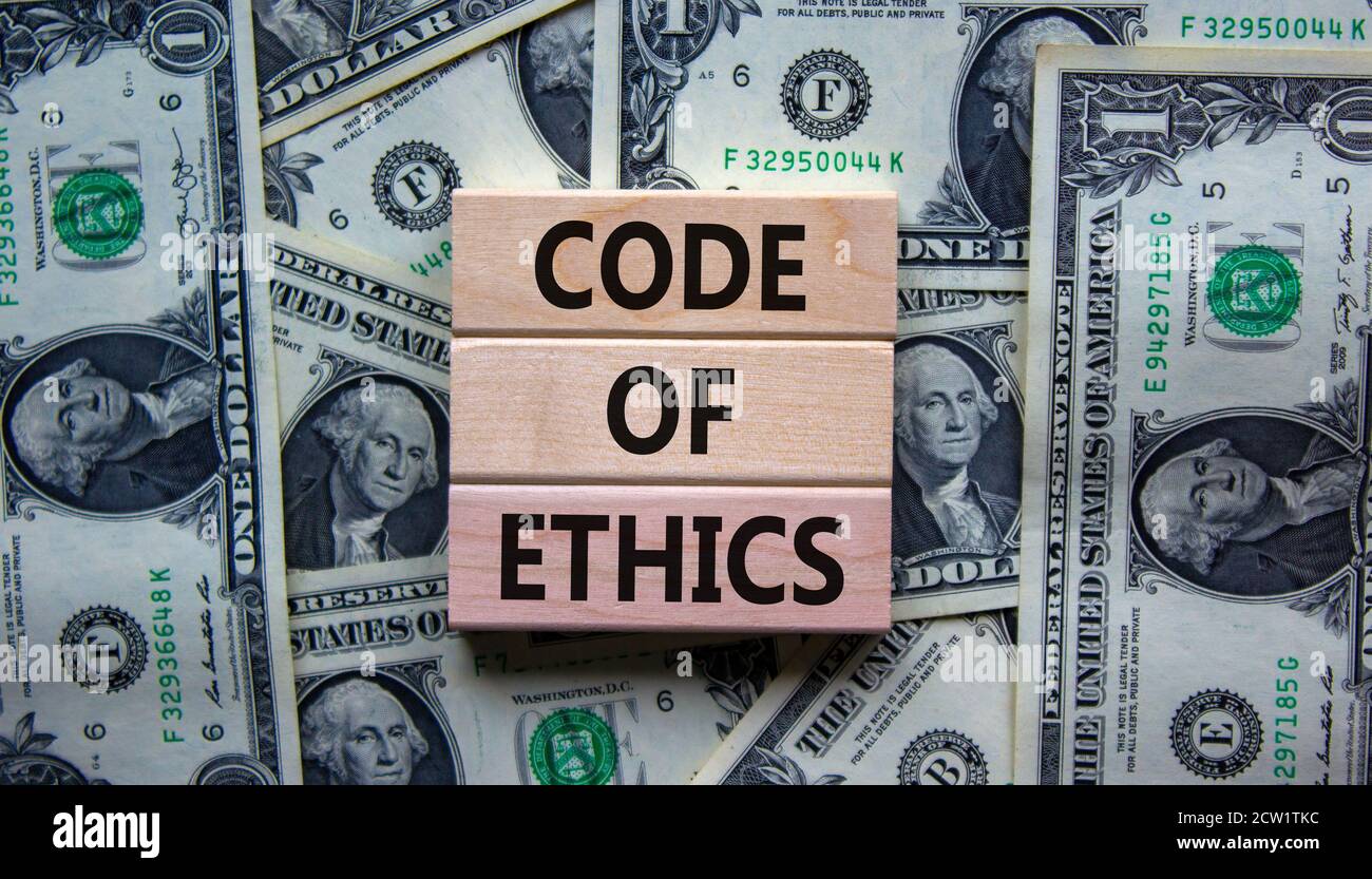 Concept text 'code of ethics' on wooden blocks on a beautiful
