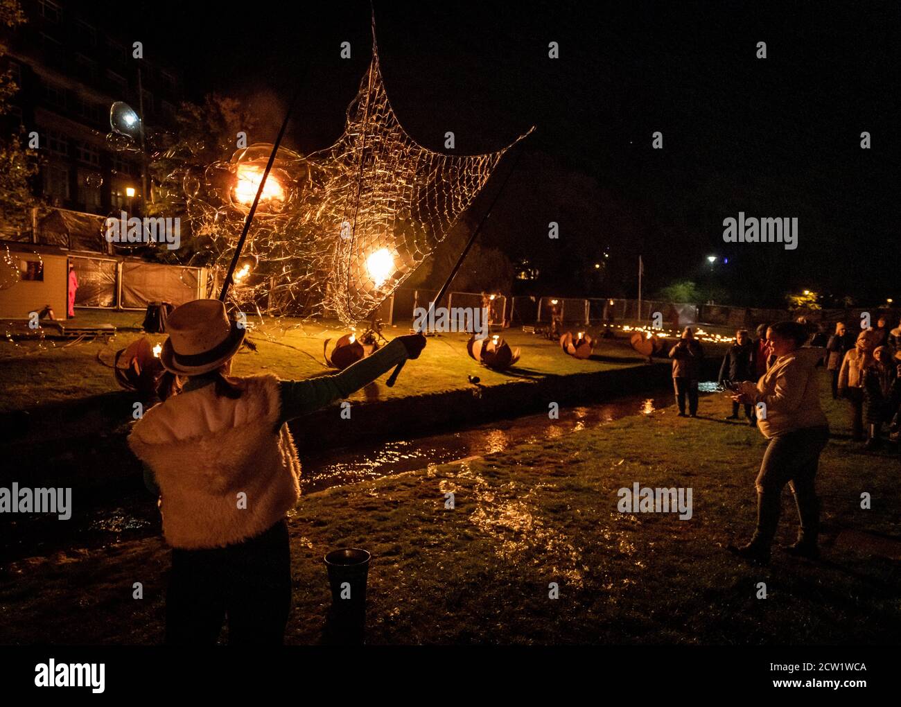 Bournemouth, UK. Saturday 26 September 2020. Visitors wacth 'The Fire Garden' by 'Walk the Plank' as part of the Arts By The Sea Fesival in Bournemouth. One of the few large festivals to go ahead this year. Credit: Thomas Faull/Alamy Live News Stock Photo