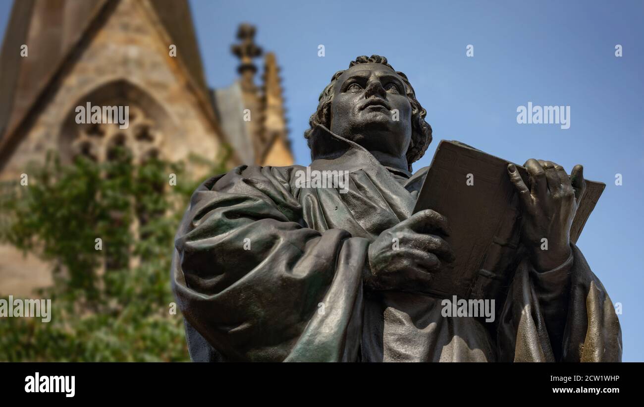 Statue of German Reformer Martin Luther in front of Kaufmannskirche (Merchant's Church) Stock Photo