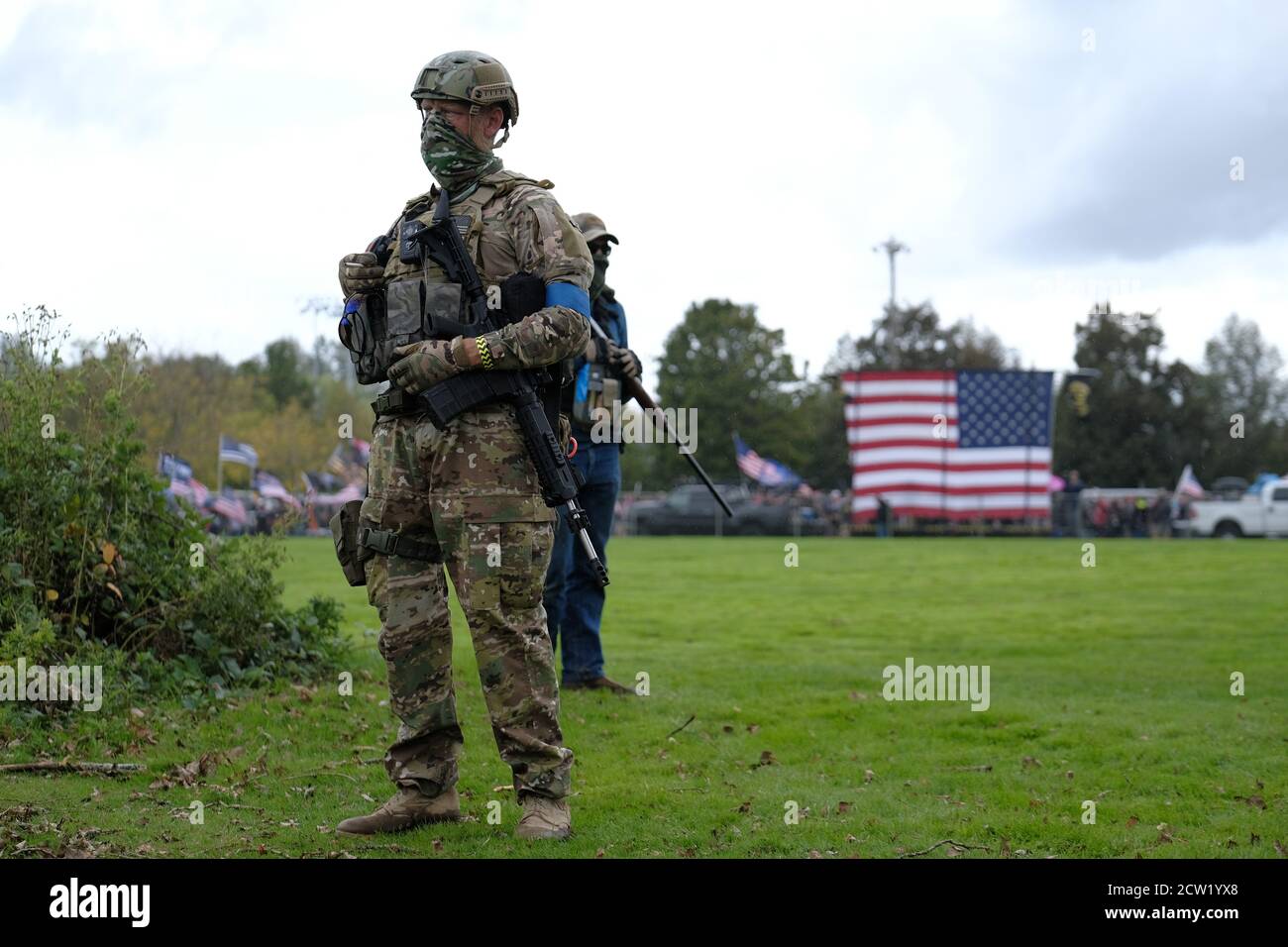 Portland, USA. 26th Sep, 2020. Men holding firearms secure the perimeter around a Proud Boys rally in Portland, Ore., at Delta Park on September 26, 2020, in support of Kenosha shooter Kyle Rittenhouse and Aaron 'Jay' Danielson who was shot dead by an antifascist protester during the ongoing Black Lives Matter protests in the city. (Photo by Alex Milan Tracy/Sipa USA) Credit: Sipa USA/Alamy Live News Stock Photo
