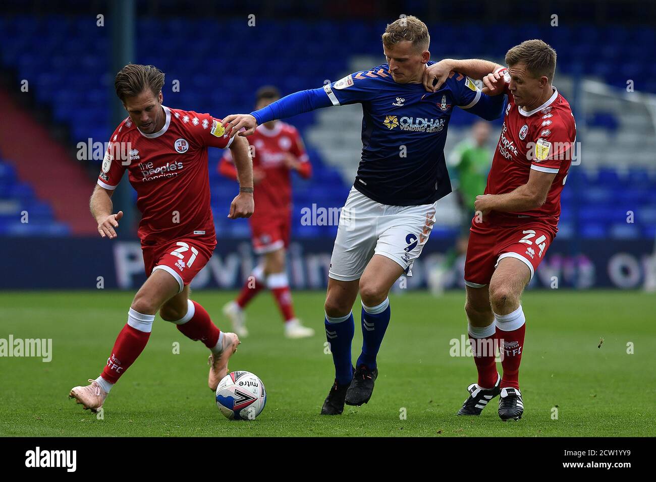 Oldham, UK. 26th Sep, 2020. OLDHAM, ENGLAND. SEPT 26TH 2020 Oldham's Danny Rowe and Crawley Town's Dannie Bulman and Tony Craig in action during the Sky Bet League 2 match between Oldham Athletic and Crawley Town at Boundary Park, Oldham on Saturday 26th September 2020. (Credit: Eddie Garvey | MI News ) Credit: MI News & Sport /Alamy Live News Stock Photo