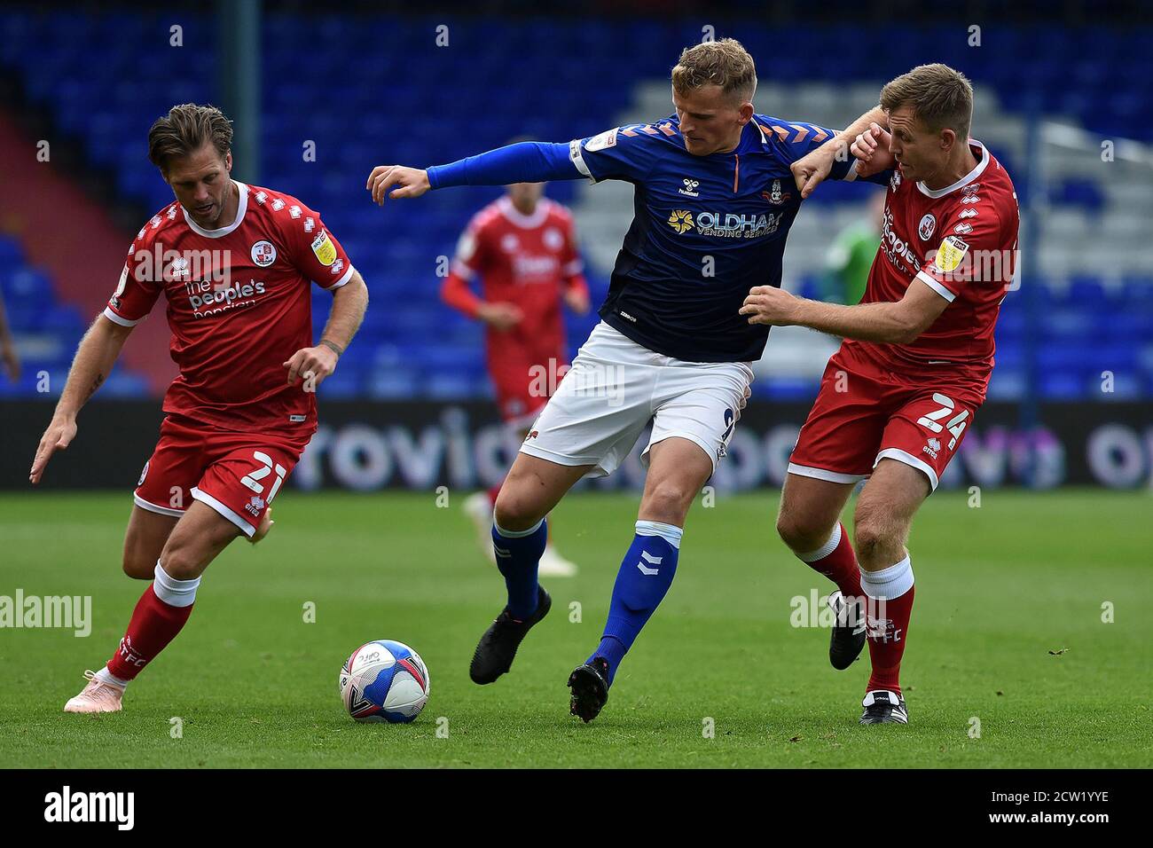 Oldham, UK. 26th Sep, 2020. OLDHAM, ENGLAND. SEPT 26TH 2020 Oldham's Danny Rowe and Crawley Town's Dannie Bulman and Tony Craig in action during the Sky Bet League 2 match between Oldham Athletic and Crawley Town at Boundary Park, Oldham on Saturday 26th September 2020. (Credit: Eddie Garvey | MI News ) Credit: MI News & Sport /Alamy Live News Stock Photo