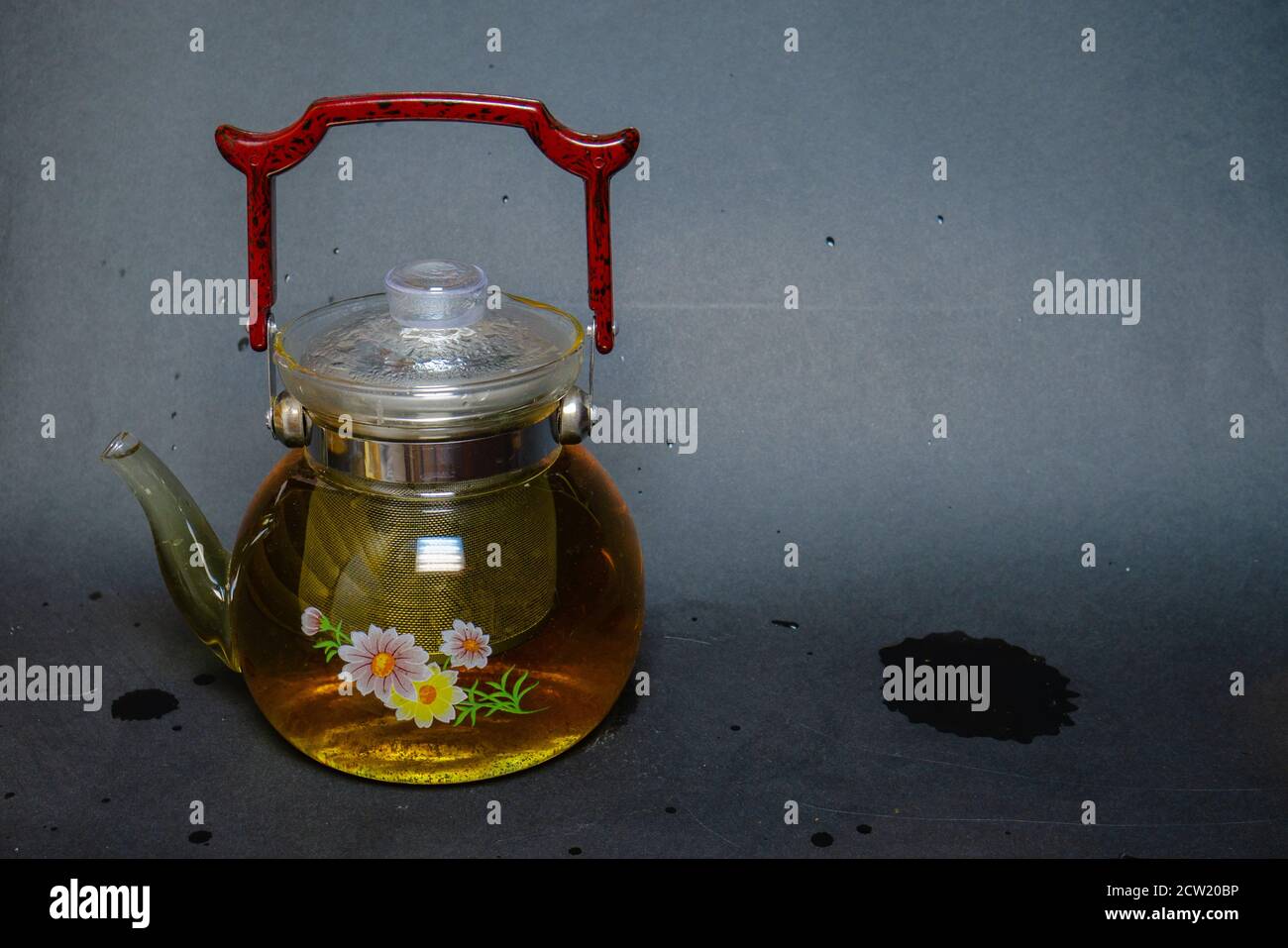 A kettle next to pressed green tea with mint Stock Photo Alamy