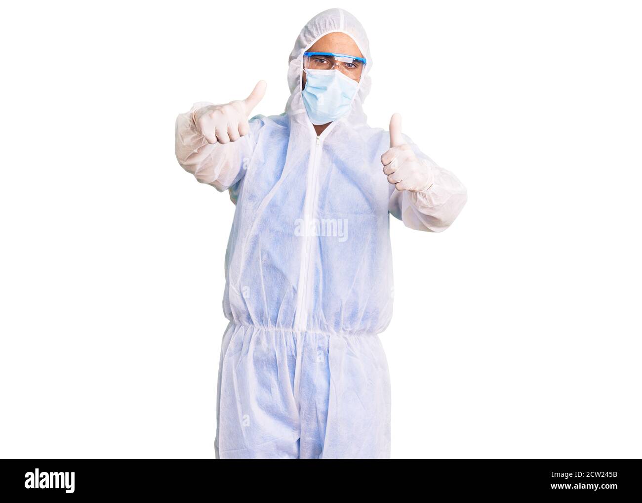 Young hispanic man wearing doctor protection coronavirus uniform and ...