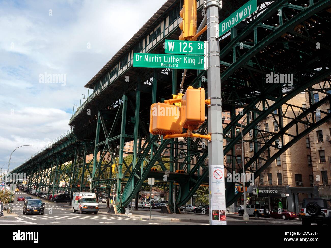 Street scene under the elevated subway station tracks at w 125th street and Broadway in Harlem Stock Photo