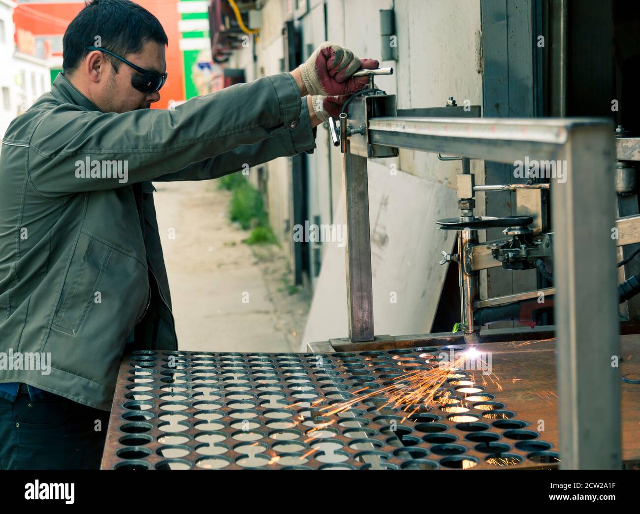 Plasma sheet metal cutting operator on a rack Stock Photo - Alamy