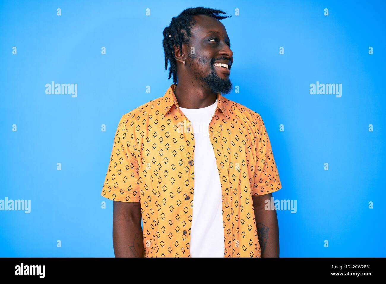 Young african american man with braids wearing casual clothes looking ...