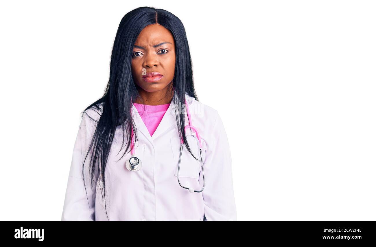 Young african american woman wearing doctor stethoscope depressed and ...