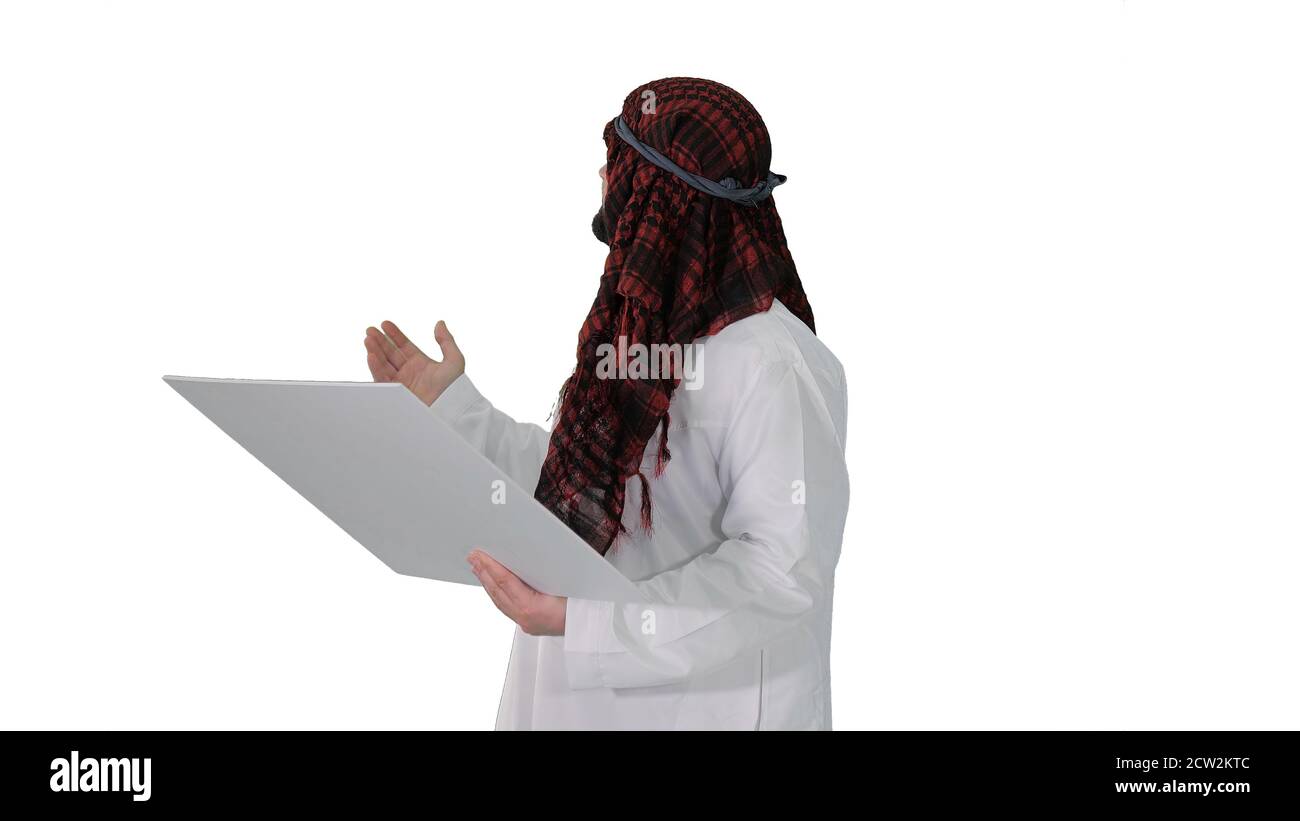 Sheikh looking at blueprint and at the object on white backgroun Stock Photo