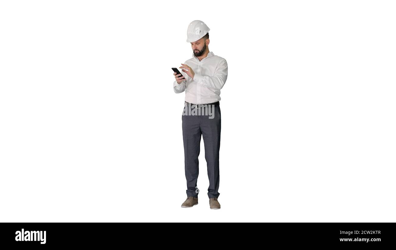Smart engineer in white shirt and safety engineering hat using s Stock Photo