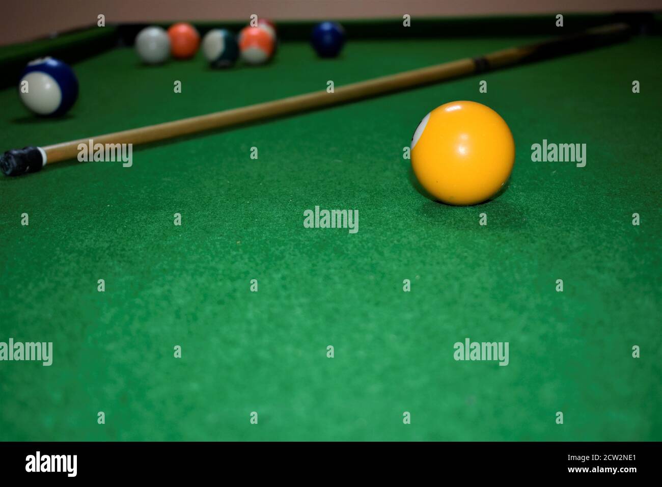 billiard table with cue and balls. Green billiards background Stock