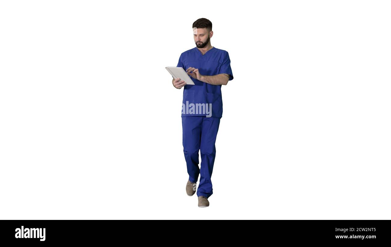 Confident concentrated focused surgeon using digital tablet on w Stock Photo