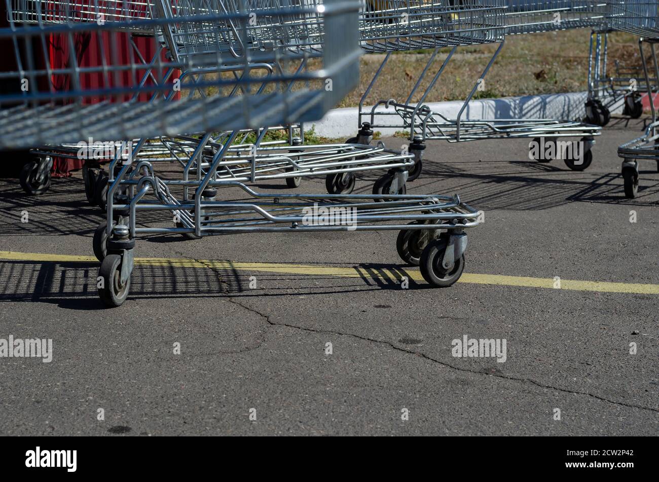 Supermarket Shopping HandCart Cart. Supermarket shopping trolleys in outdoor parking. Empty