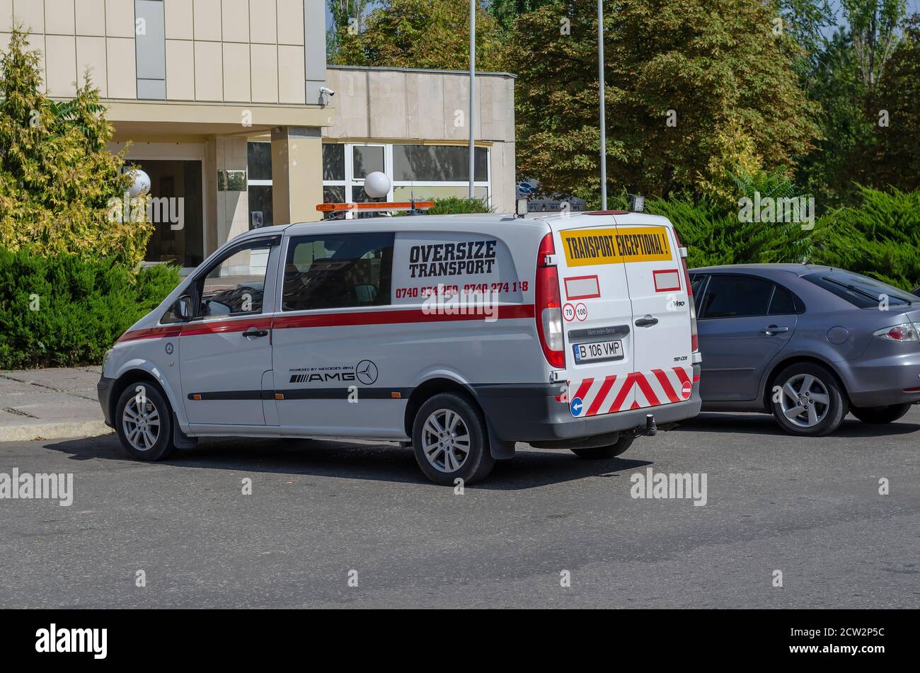 Nikolaev, Ukraine - September 19, 2020: Pilot Vehicle Escorting Oversize Transports in the parking lot at the hotel. Mercedes Benz Vito 110 CDI with s Stock Photo
