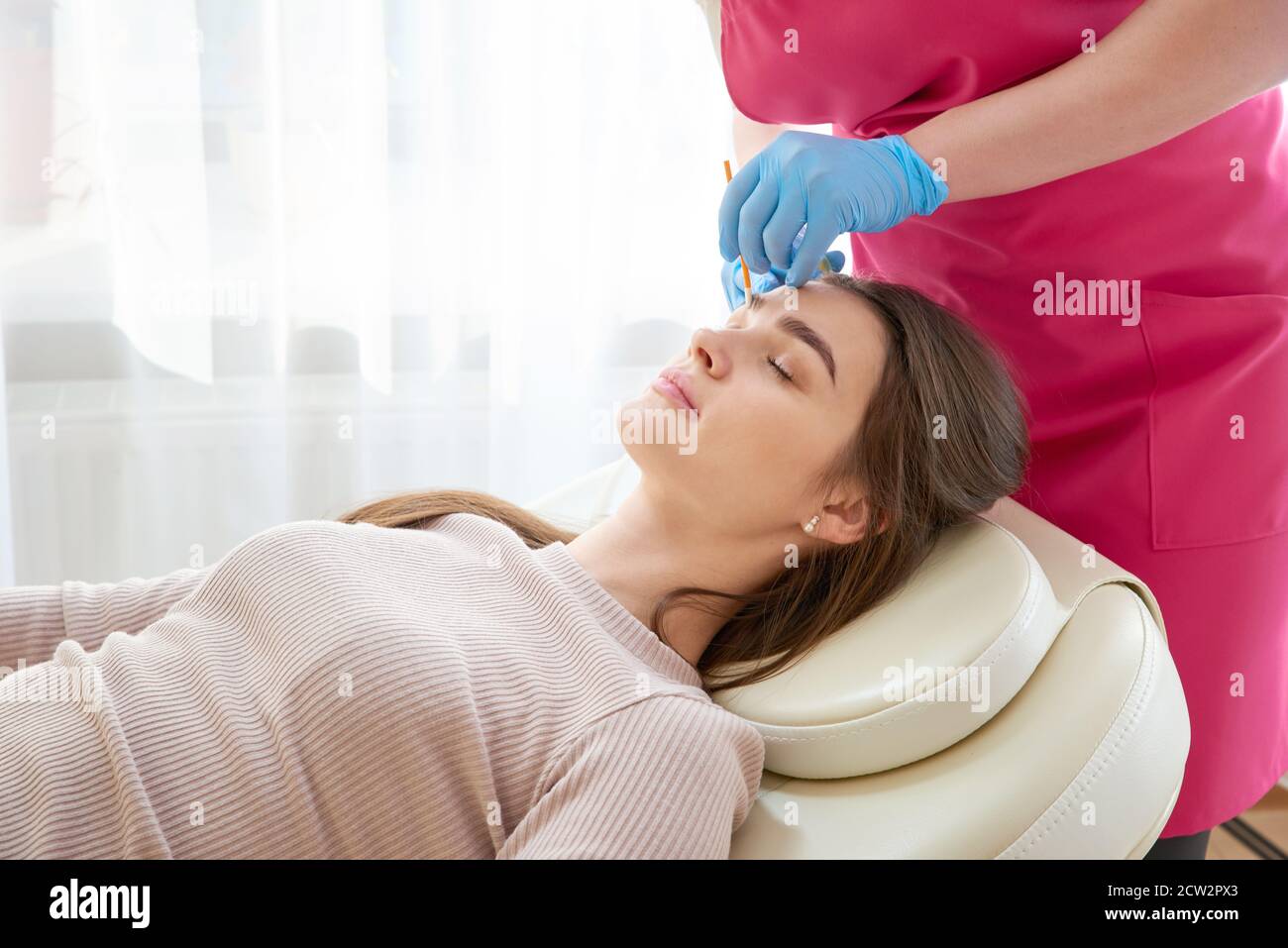 Professional eyebrow correction in beauty salon Stock Photo Alamy