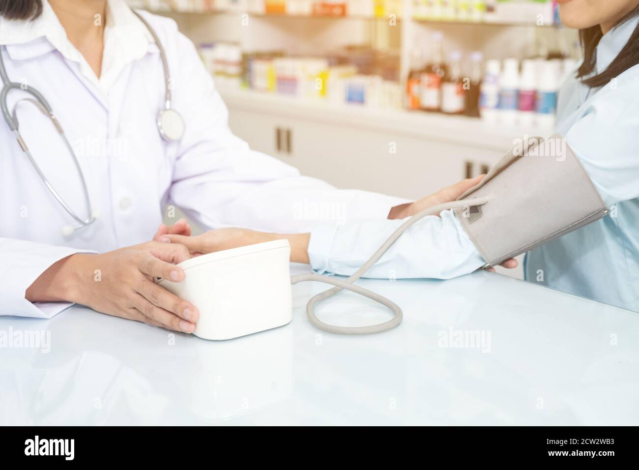 Nurse Taking Blood Pressure High Resolution Stock Photography and 