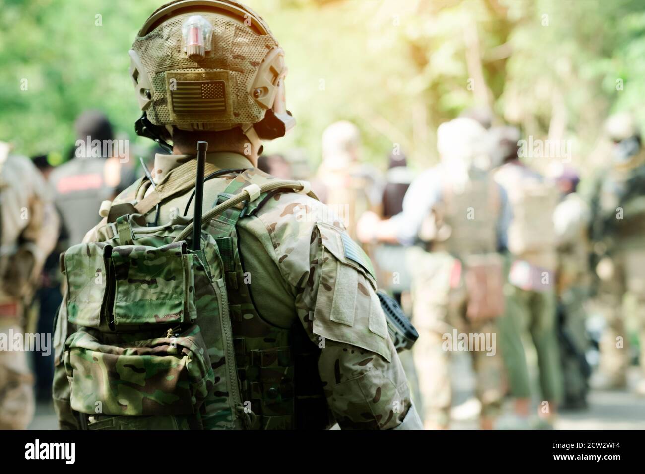 Back View Fully Equipped Soldiers Wearing Camouflage Uniform Attacking  Enemy, Airsoft military game player in camouflage uniform Stock Photo -  Alamy