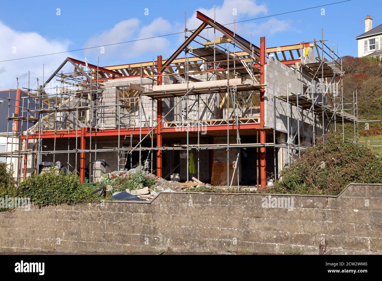 A traditional build house under construction showing a steel frame