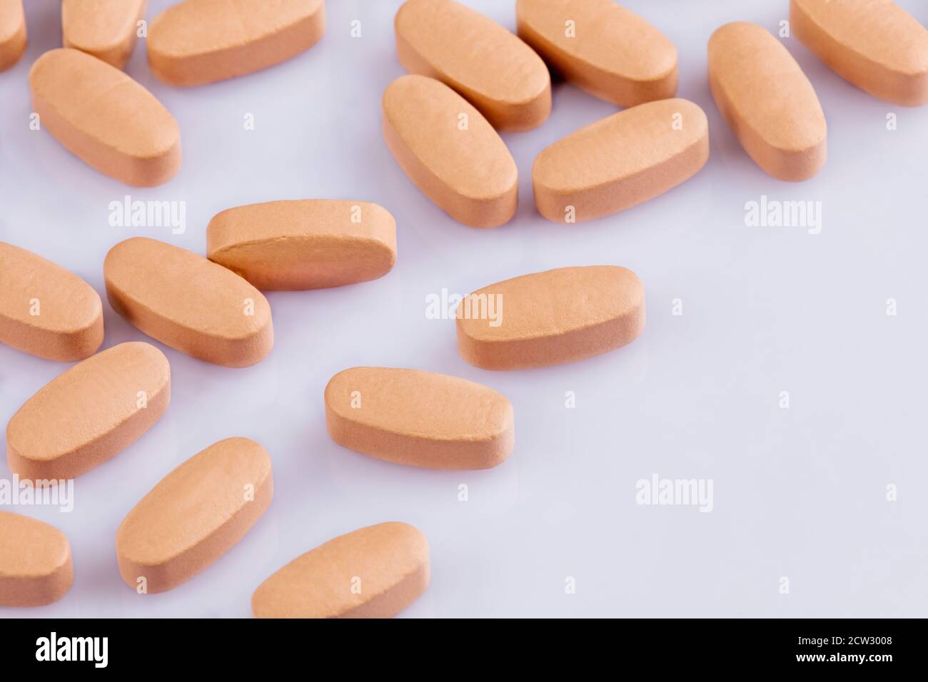 Close up of Multi-Vitamin and mineral on a white background with shallow Depth of field Stock Photo