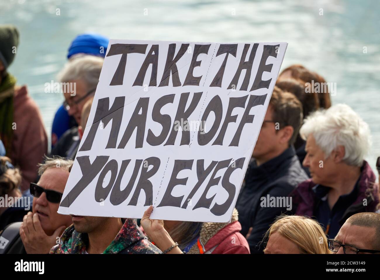 London, UK. - 26 Sept 2020: A placard, critical of government regulations during the coronavirus pandemic, is held aloft at a protest in Trafalgar Square. Stock Photo