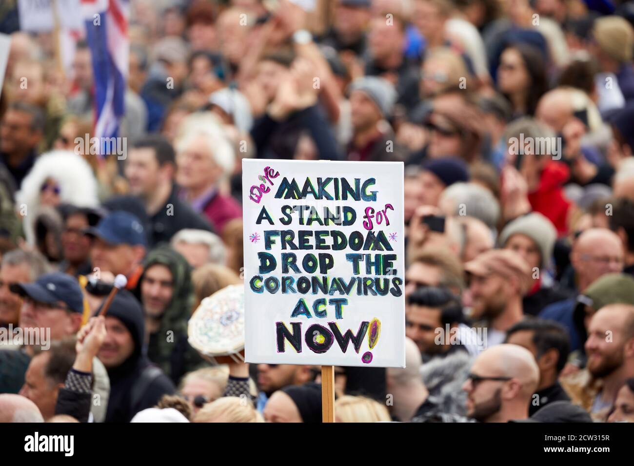 London, UK. - 26 Sept 2020: A placard, critical of government regulations during the coronavirus pandemic, is held aloft at a protest in Trafalgar Square. Stock Photo